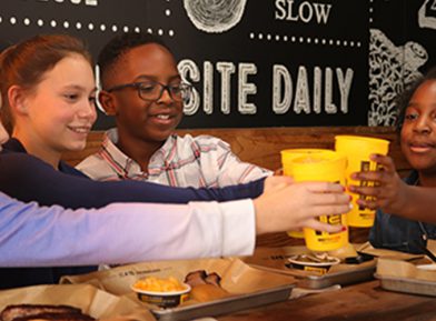 Kids enjoying their Dickey's Barbecue Pit