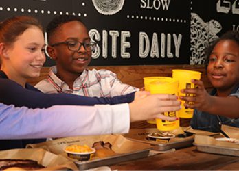 Kids Enjoying A Meal At Dickey's Barbecue Pit