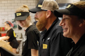 dickey's barbecue pit franchise employees laughing in kitchen